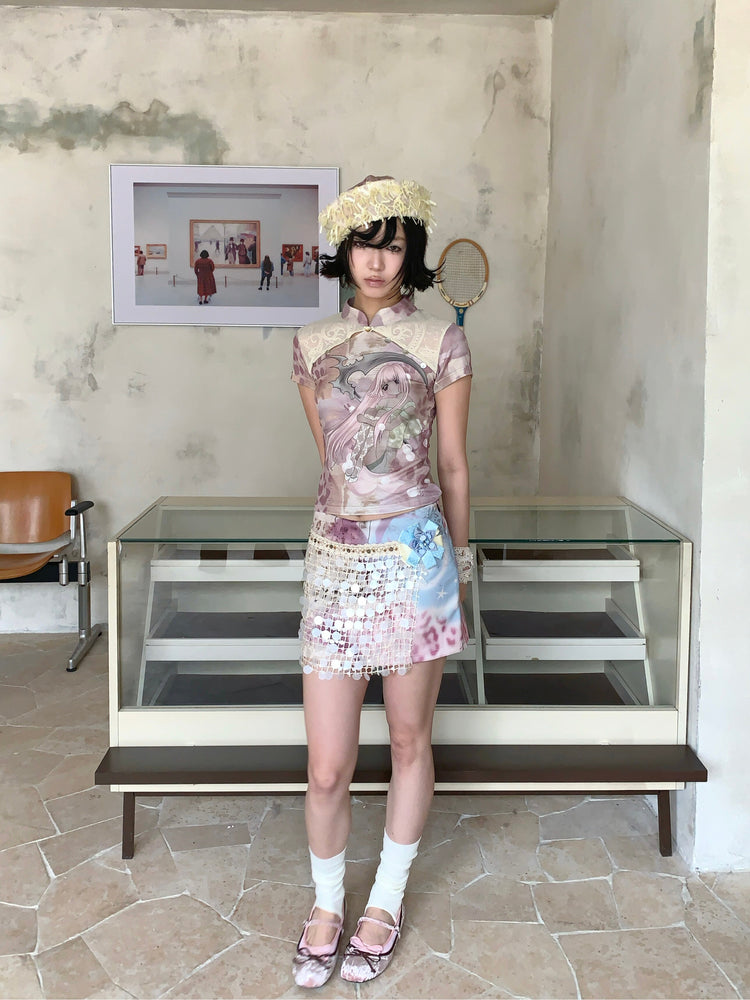 4RE1GN PINK REAPER lace-panel mandarin tee in pink multicolor — full-length front modeled view with hands behind the back and pastel mini skirt