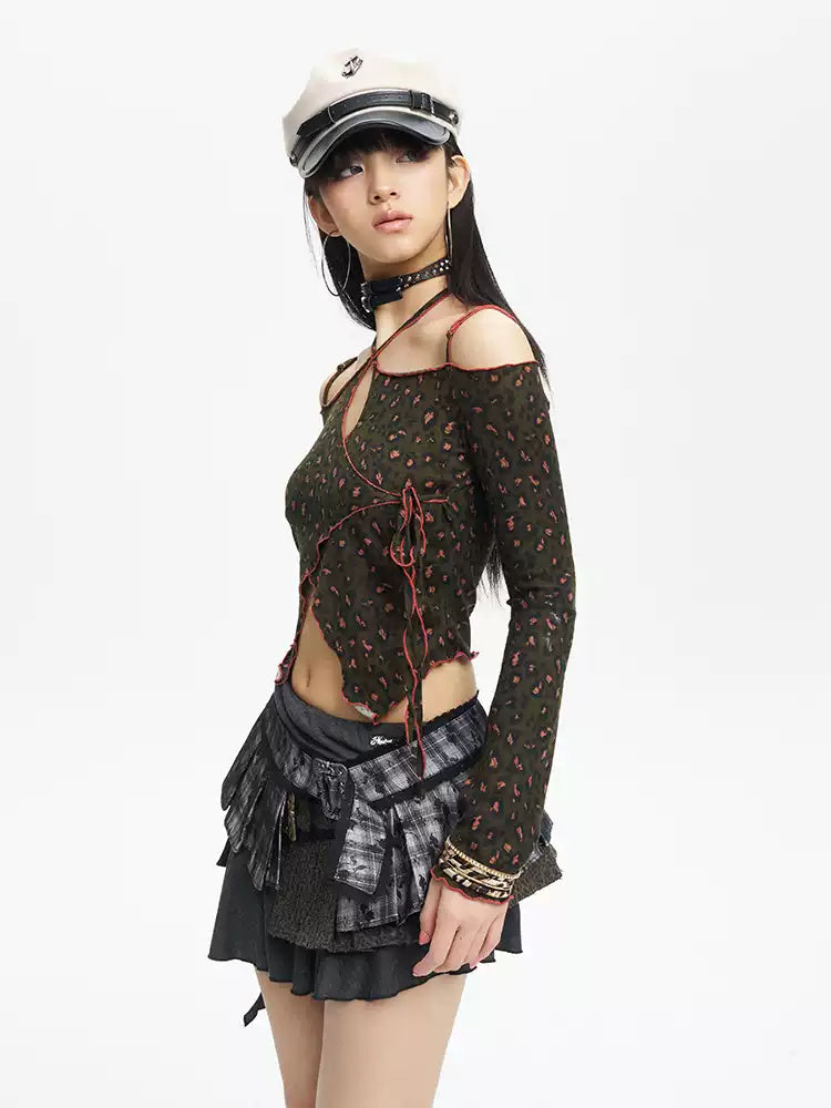 Three-quarter studio portrait of the leopard lace-up knit top