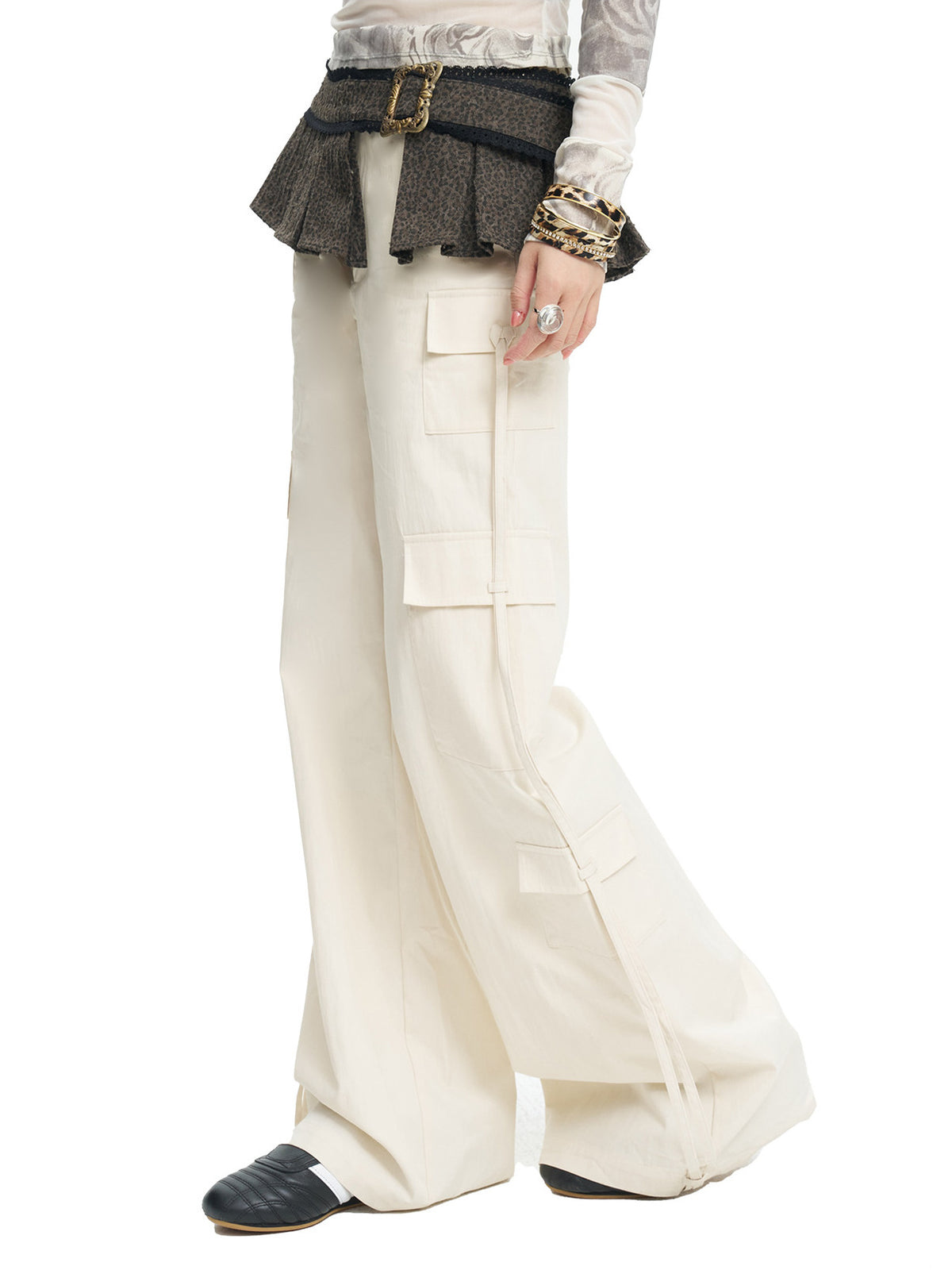 NEXT PASSPORT white drawstring multi-pocket cargo pants in white — side close studio view showing cargo pockets and hanging drawstrings.