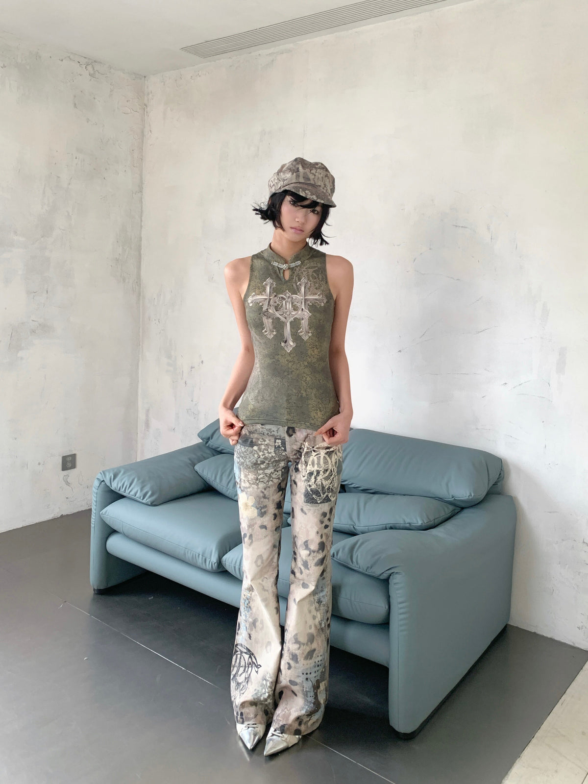4RE1GN TRIPLE CROSS mandarin sleeveless top in olive green — three-quarter modeled view showing the mandarin collar