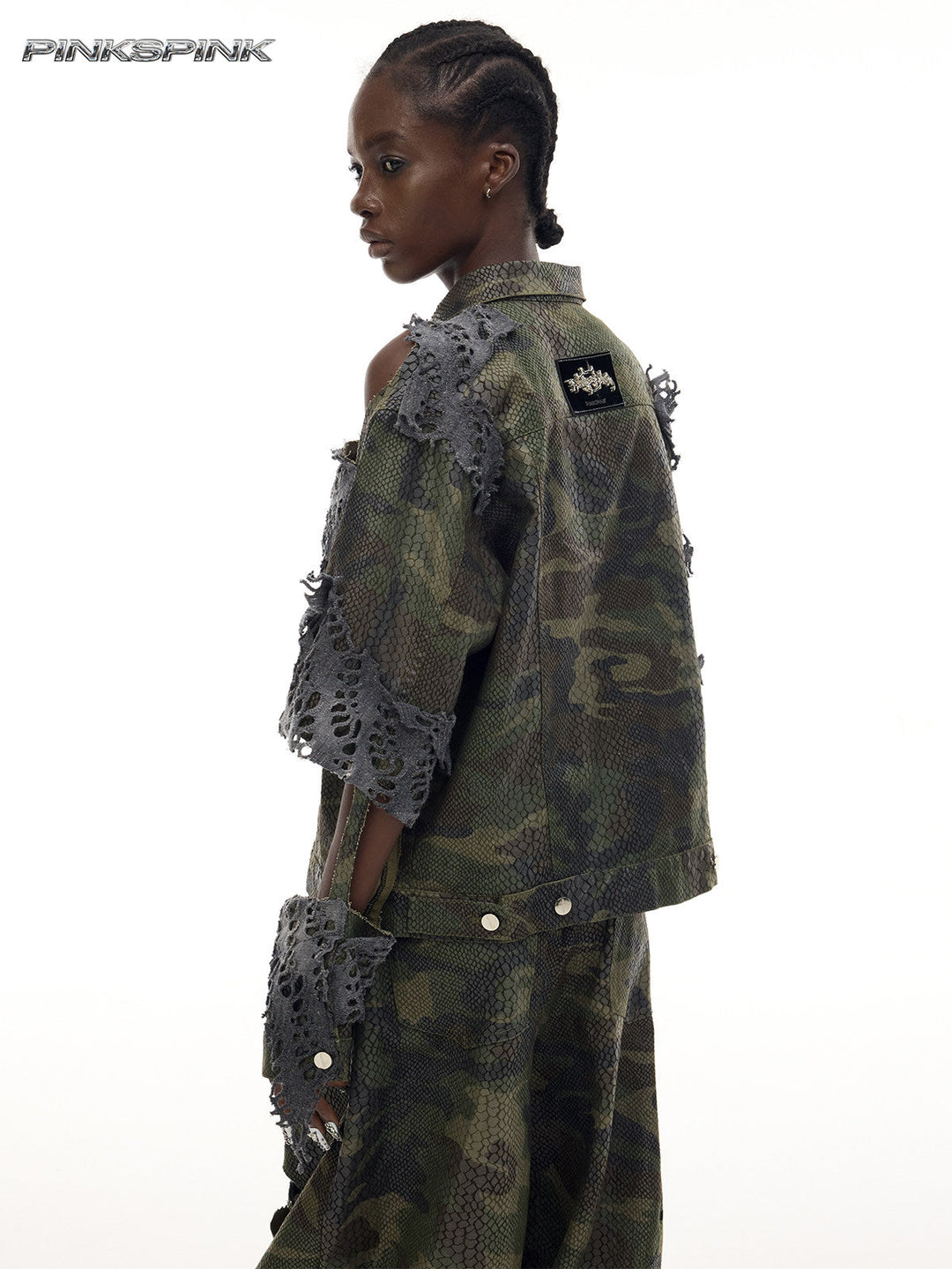 PINKSPINK ELECTRIC MOON distressed camouflage denim jacket — back three-quarter modeled view showing shoulder cutouts
