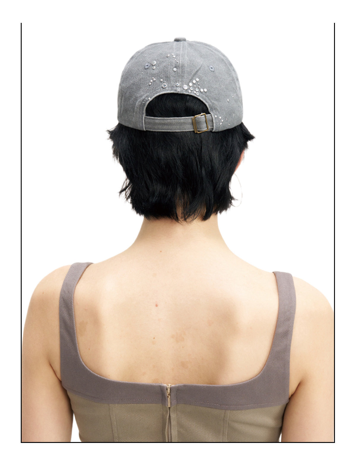 NEXT PASSPORT butterfly rhinestone eyelet baseball cap — rear modeled view showing the adjustable strap
