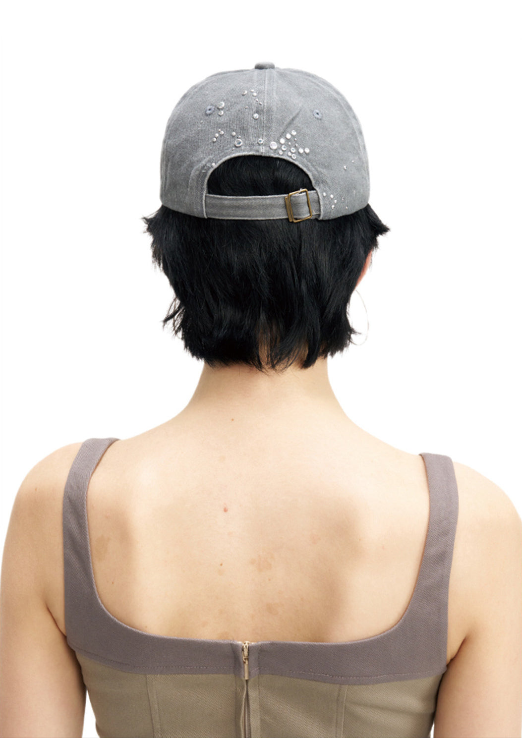 NEXT PASSPORT butterfly rhinestone eyelet baseball cap — rear modeled view showing the adjustable strap
