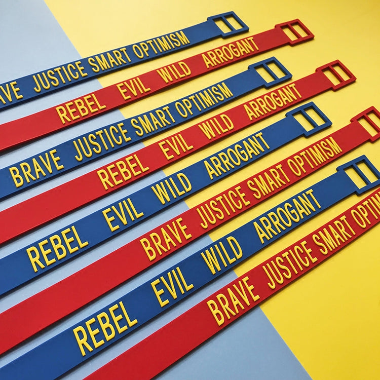 EOH-STUDIO BTBM red and blue BRAVE and EVIL silicone straps, diagonal product arrangement.