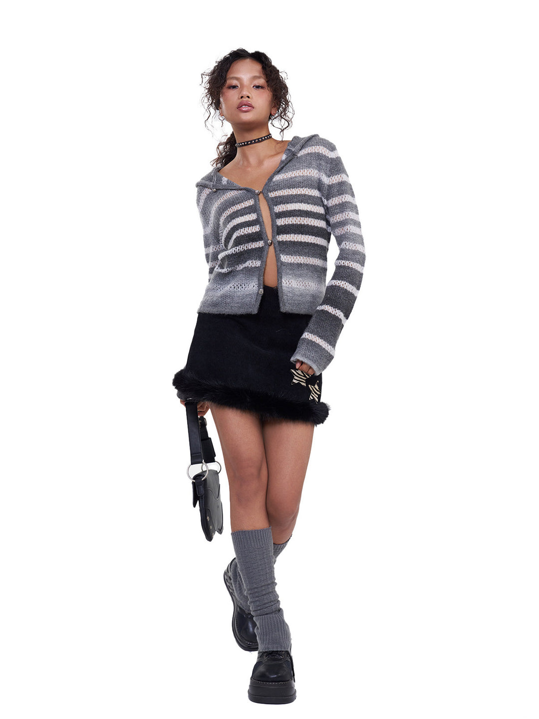 NEXT PASSPORT black corduroy faux-fur trim mini skirt — modeled walking view