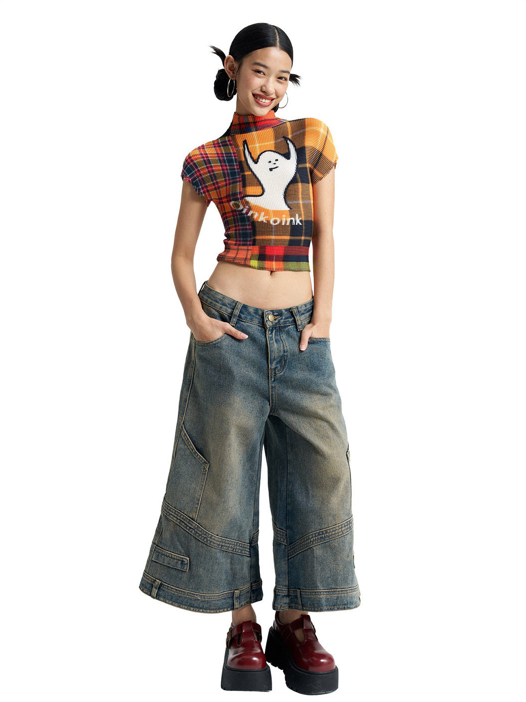 Hands-in-pockets view of NEXT PASSPORT deconstructed wide-leg denim capri pants