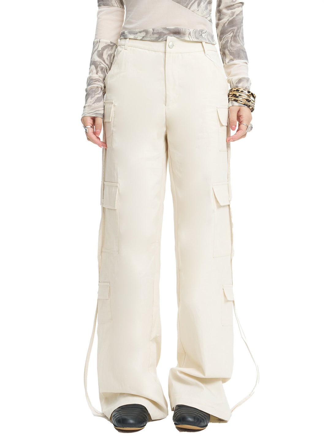 NEXT PASSPORT white drawstring multi-pocket cargo pants in white — front close studio view showing the multi-pocket legs.
