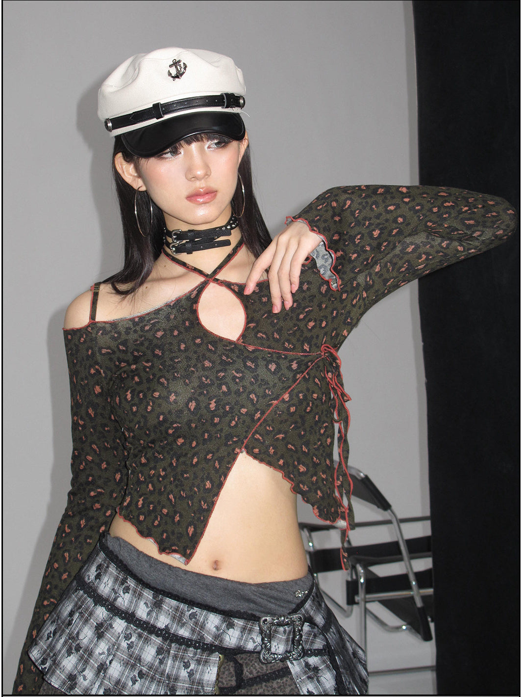 Close modeled view of the leopard-print off-shoulder top