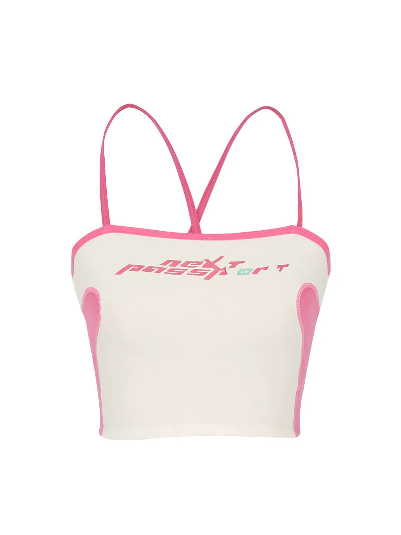 NEXT PASSPORT RETROFUTURE color-block crop camisole — white garment-only front view with pink contrast trim and chest logo.