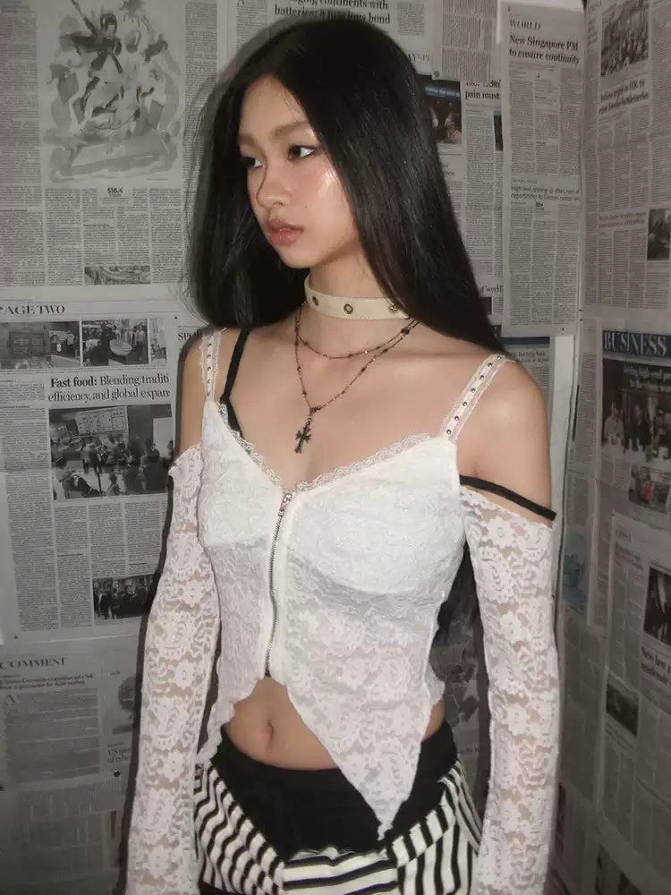 NEXT PASSPORT white lace off-shoulder zip crop top — newspaper-set detail view