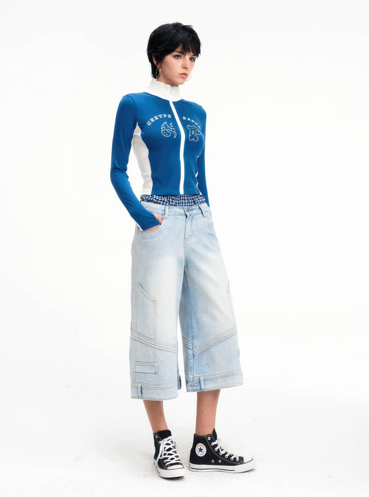 Full-length front studio view of the light-wash cropped jeans
