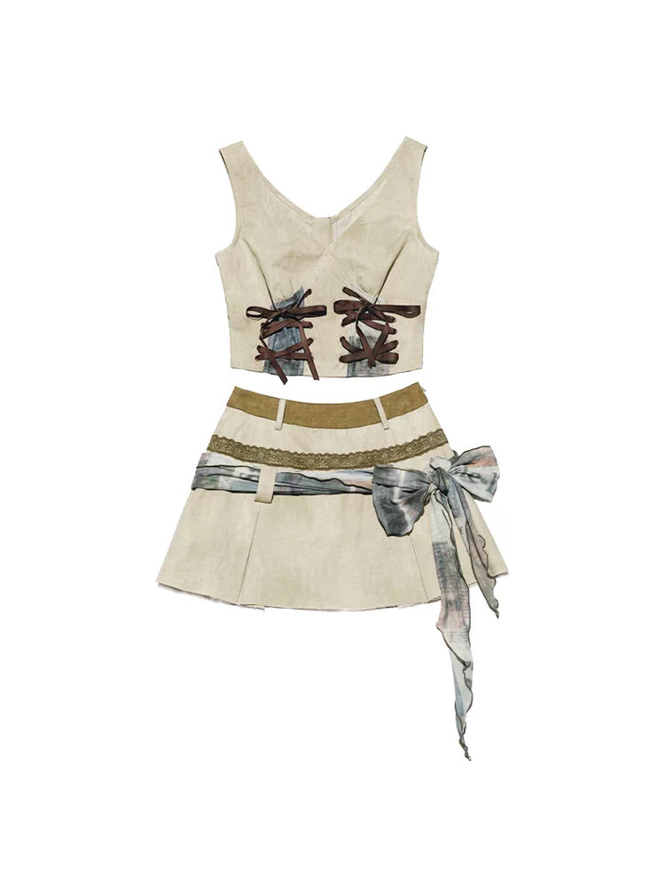 Next Passport vest and mini skirt set laid out on white