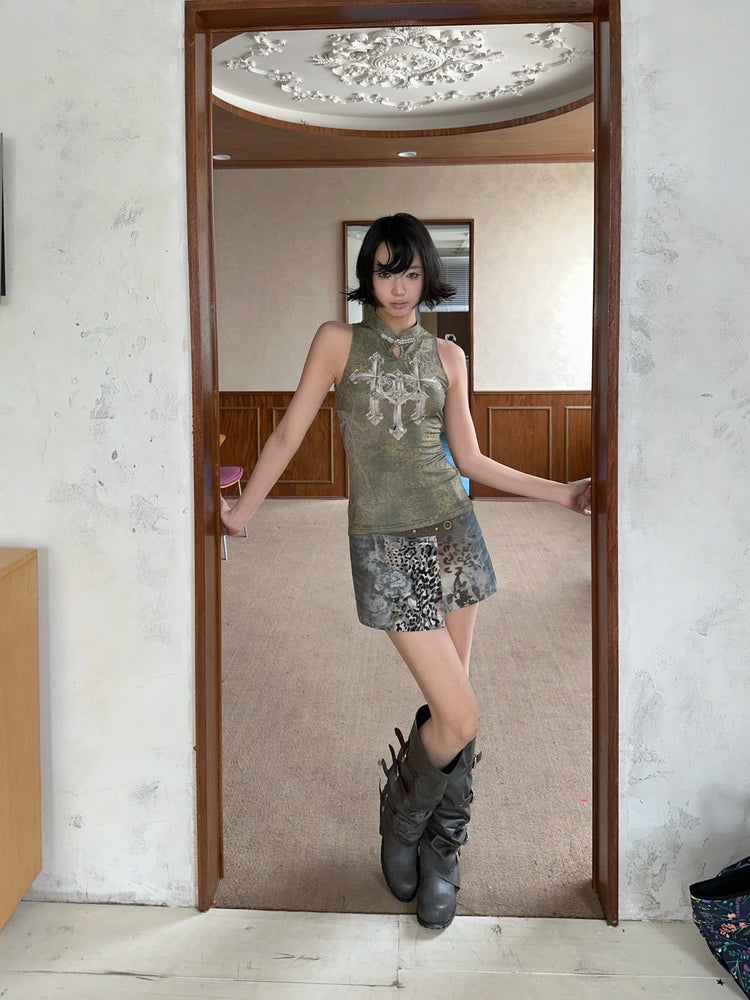 4RE1GN TRIPLE CROSS mandarin sleeveless top in olive green — front modeled view beside a doorway