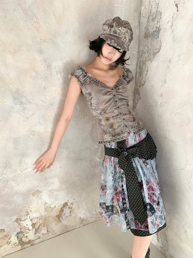4RE1GN CROSS RIBBON jacquard lace layered skirt in multicolor — angled modeled view styled with a ruffled vest