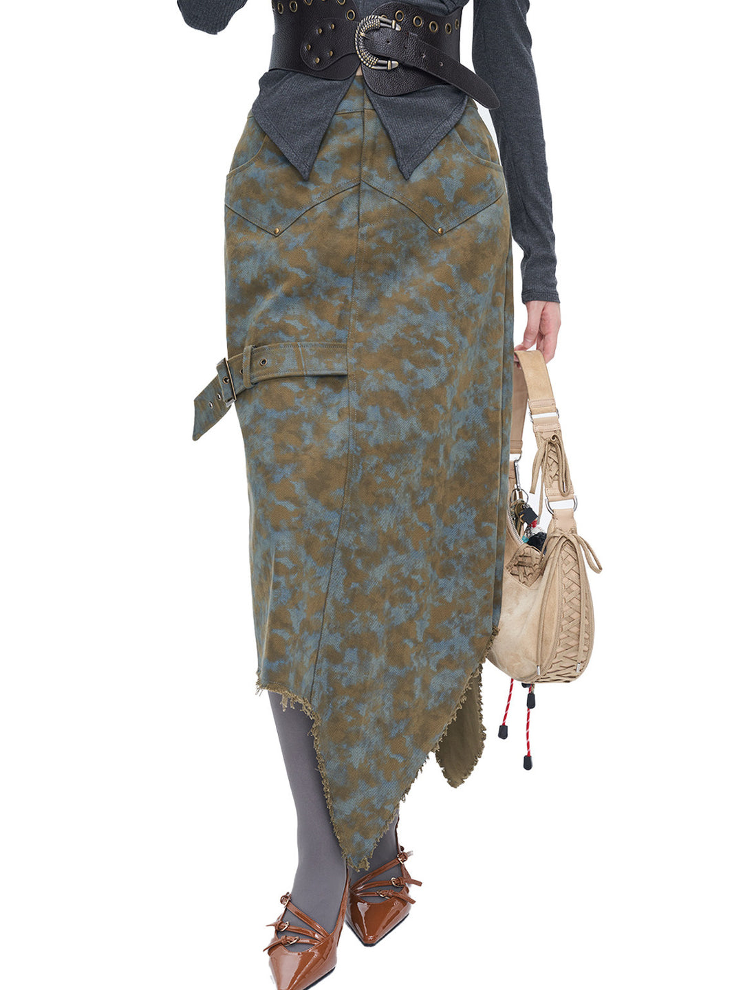 NEXT PASSPORT blue-brown tie-dye asymmetric denim midi skirt — close front modeled view emphasizing the pointed raw hem.