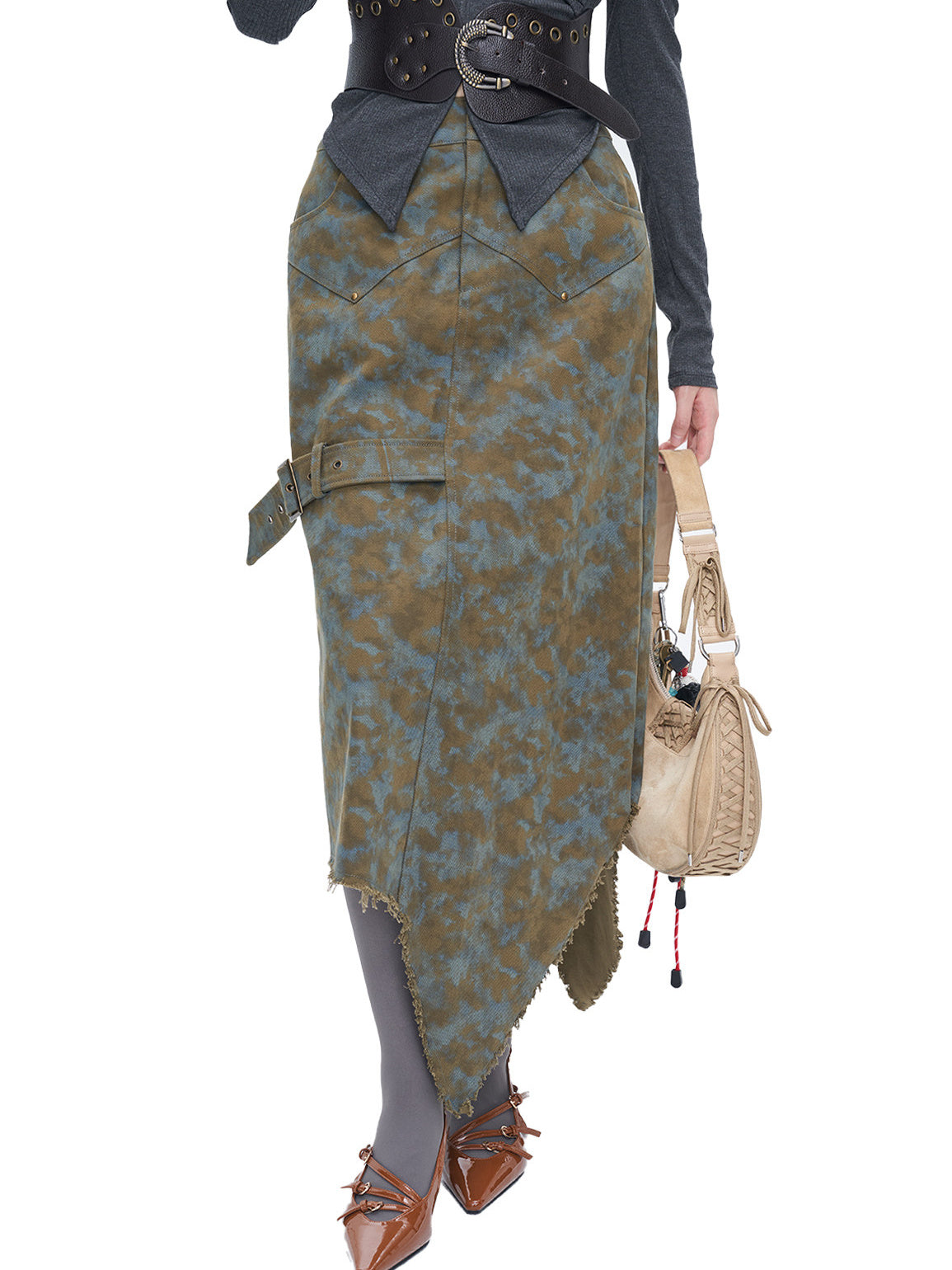 NEXT PASSPORT blue-brown tie-dye asymmetric denim midi skirt — close front modeled view emphasizing the pointed raw hem.
