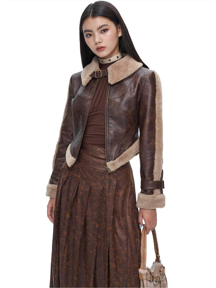 Brown faux-suede pleated maxi skirt styled with matching jacket