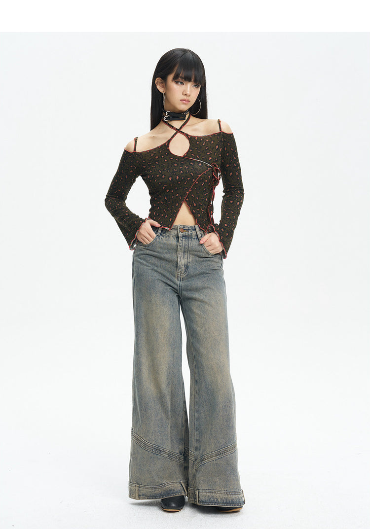 Full-length front view of the leopard knit top styled with jeans
