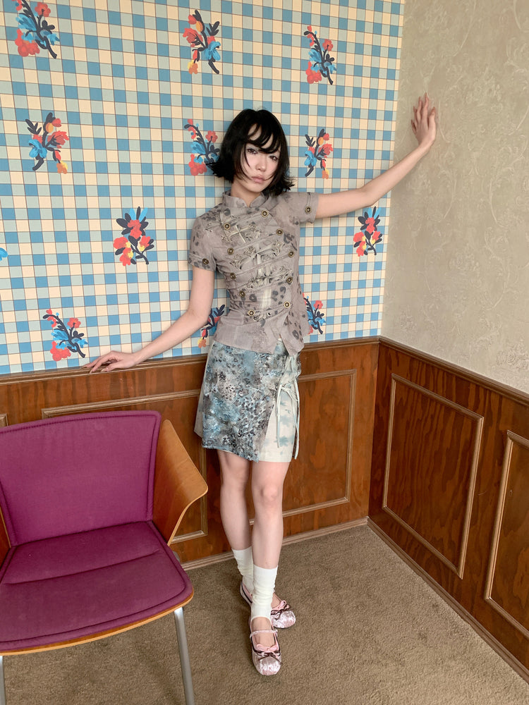 4RE1GN BLUE BLOOM tie-front layered skirt in blue multicolor — full-length modeled view with one arm raised