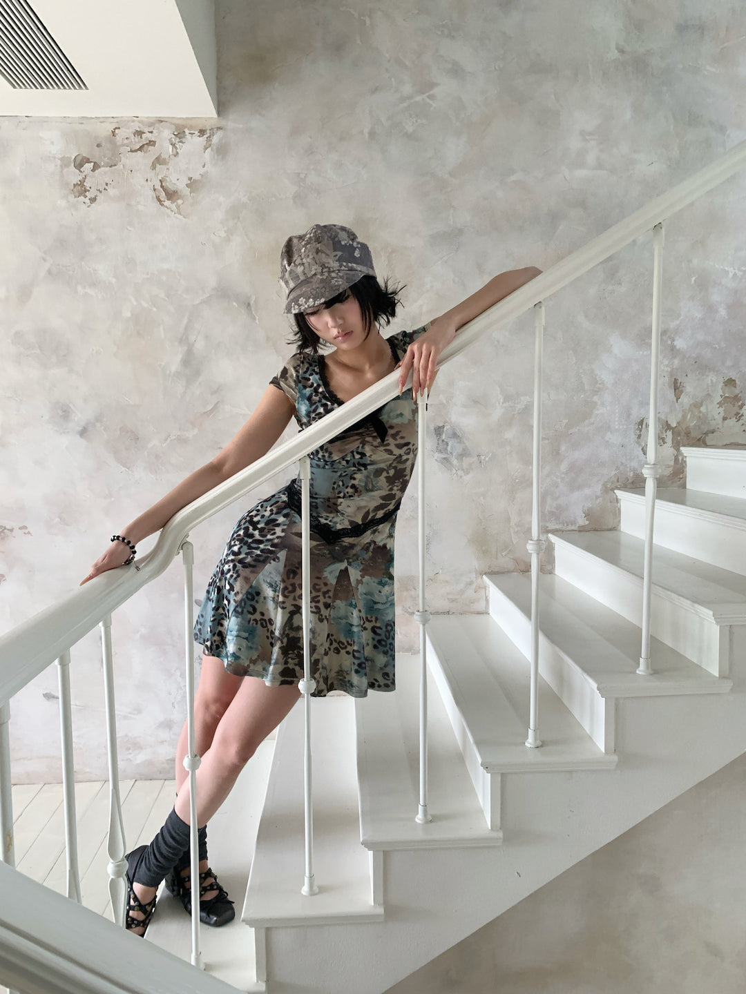 4RE1GN SEA BLUE leopard floral lace dress in gray blue — full-length modeled view leaning on a stair rail