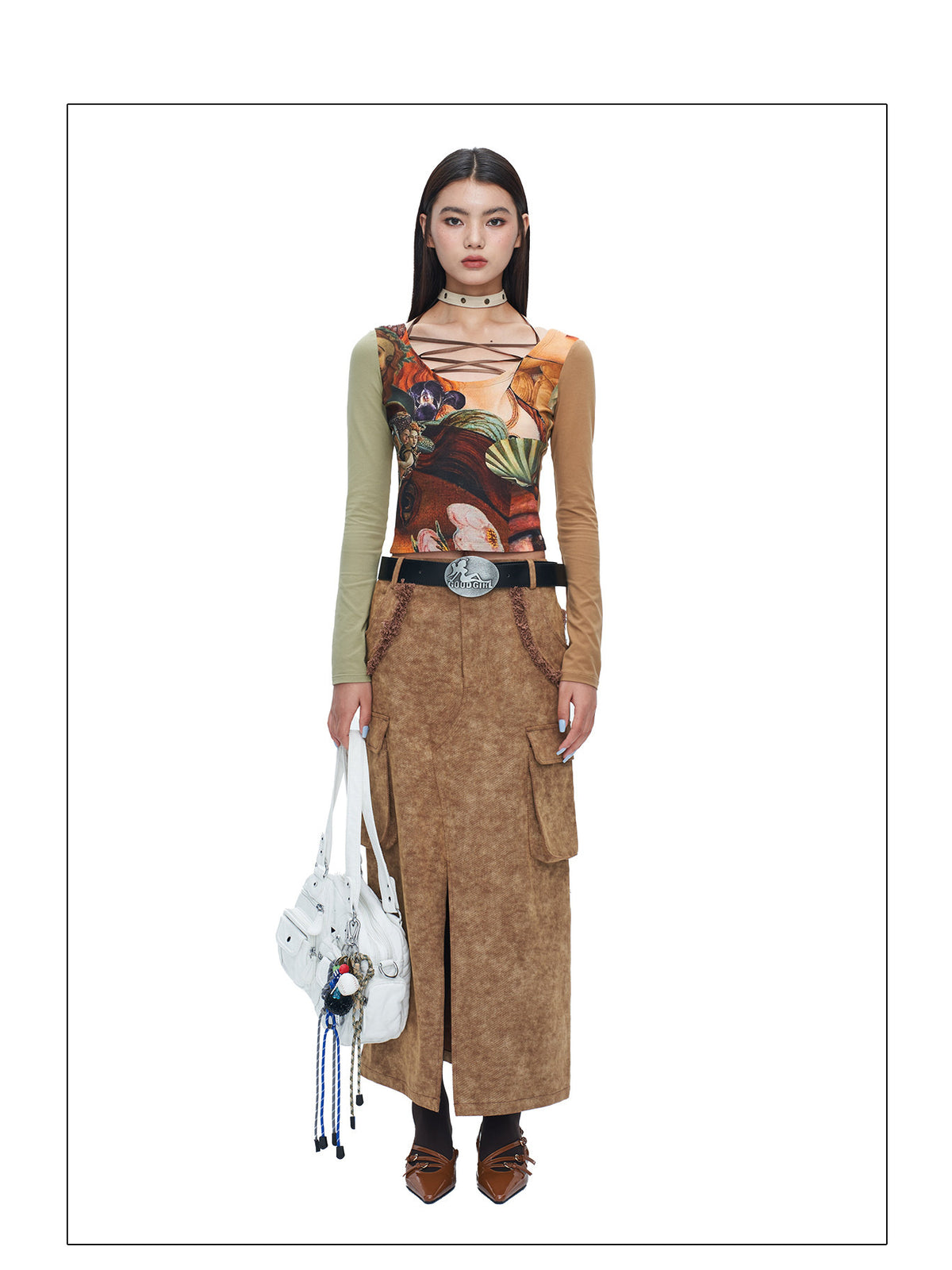 Full front studio view of NEXT PASSPORT brown raw-edge slit denim maxi skirt