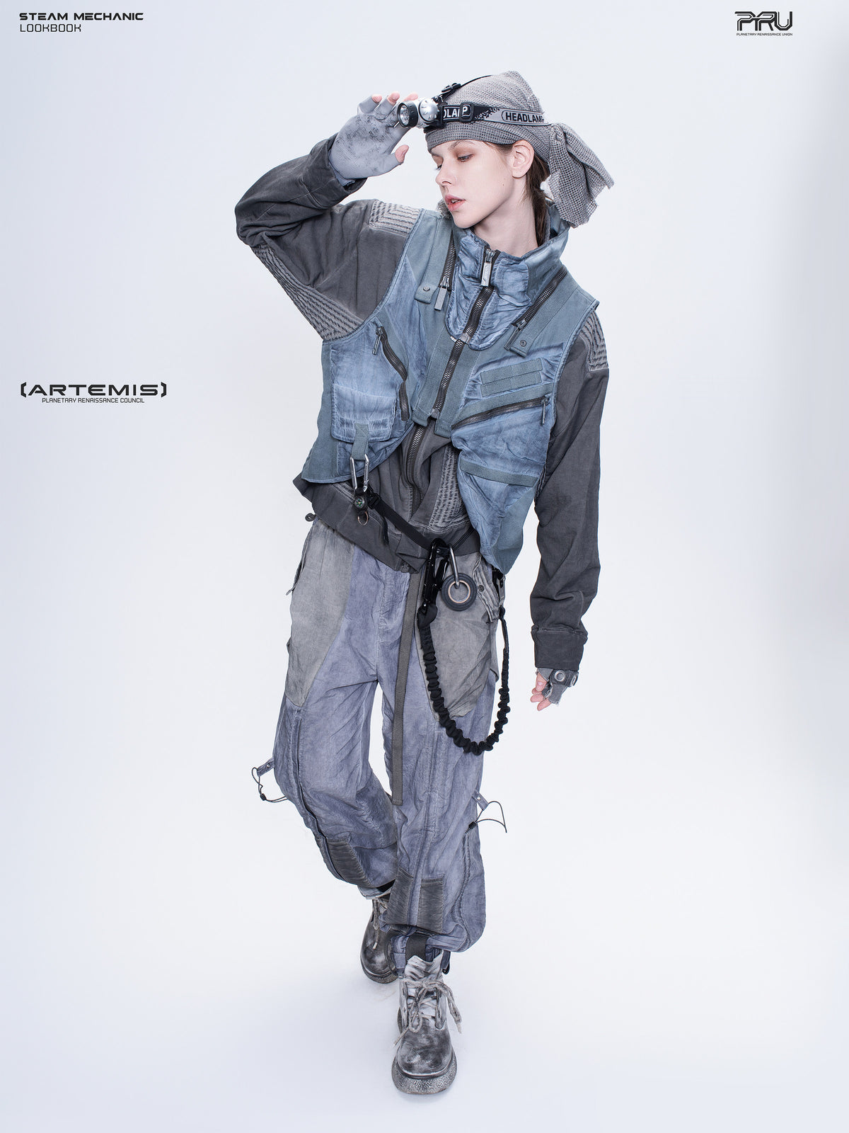 FISSION modular vest in star blue, full-body female model styling with a headlamp