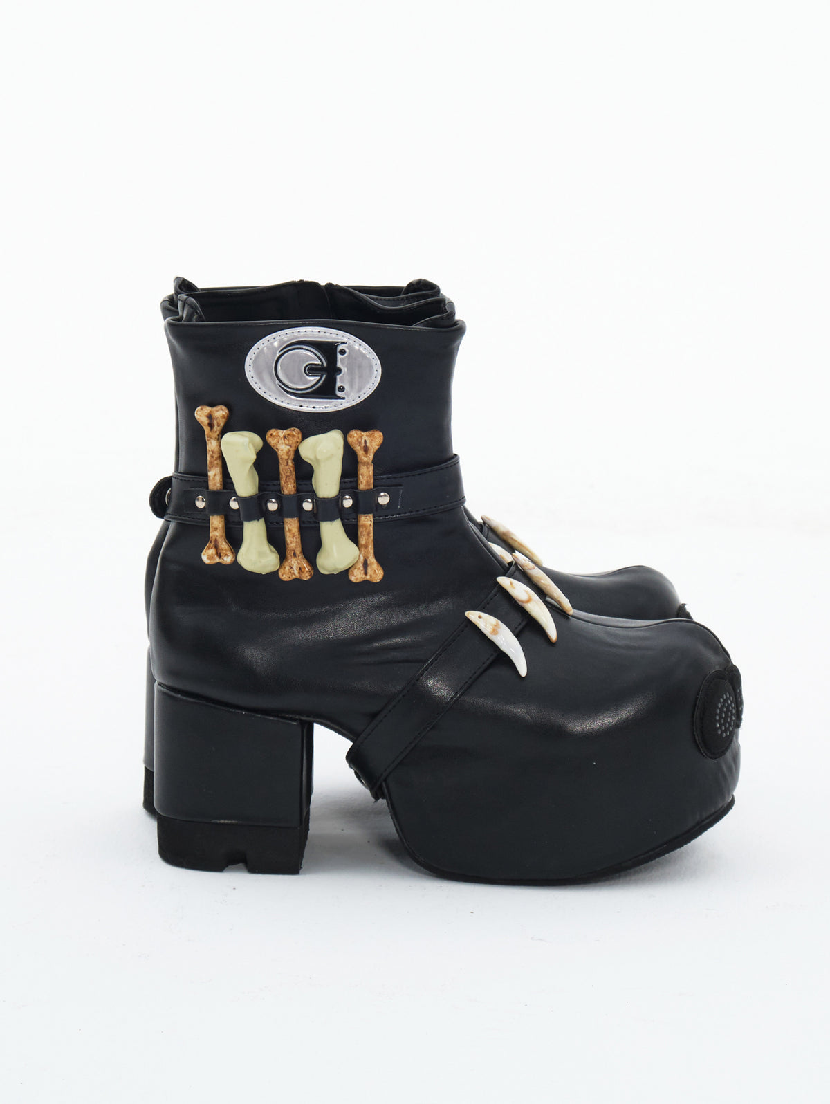 EMBRYO BONE LIFT detachable-bone platform boots — inner side view showing the removable bone details and fastening straps