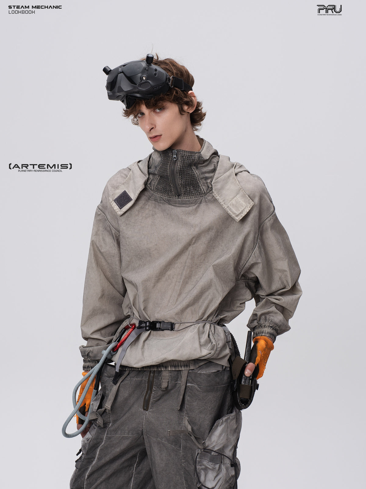 PIONEER meteorite-gray mesh hoodie, angled front modeled view with one hand at the hip