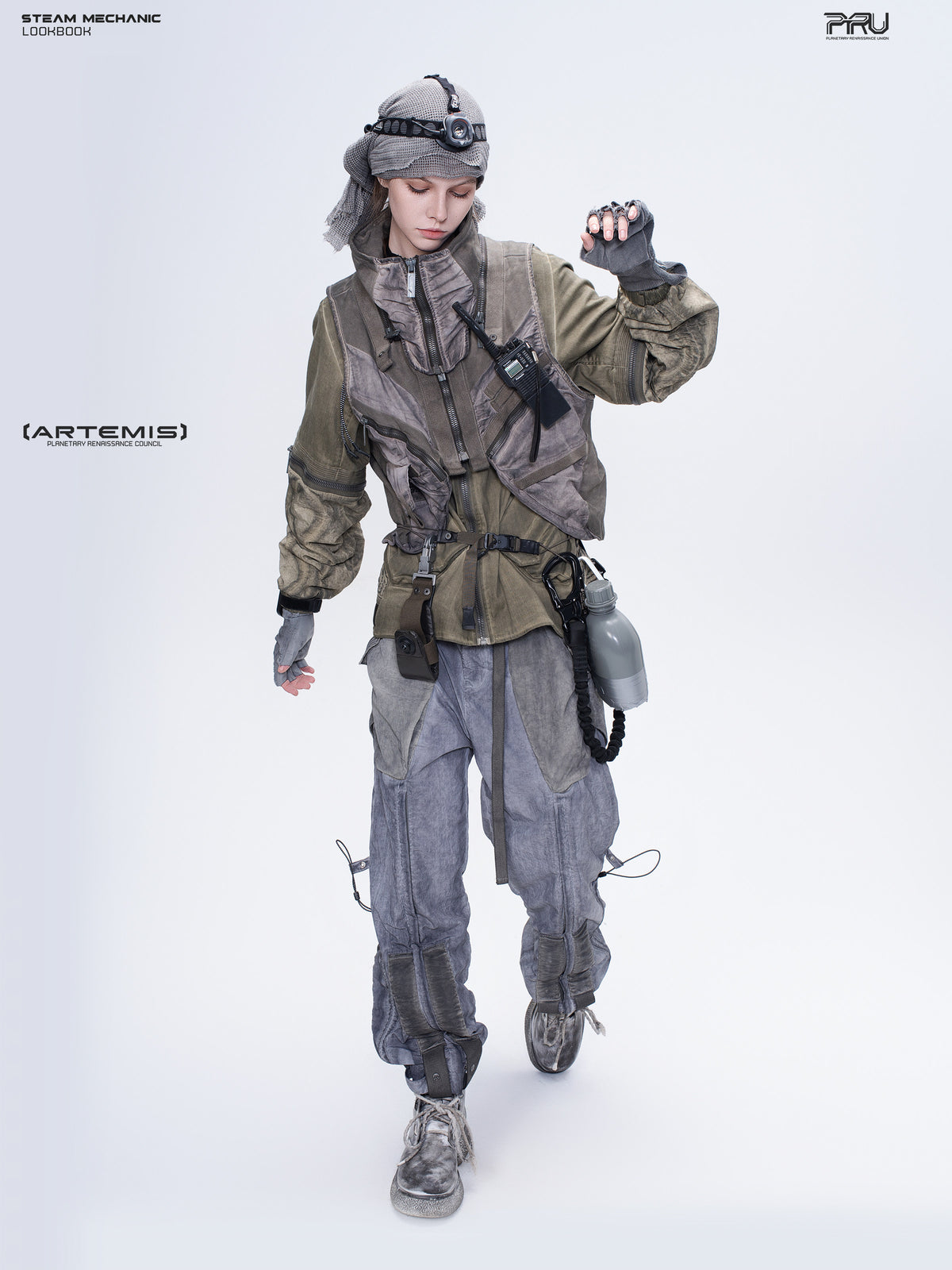 STEAM FUNCTION PIONEER mercury-brown detachable-sleeve jacket, layered styling with a grey utility vest, walking pose