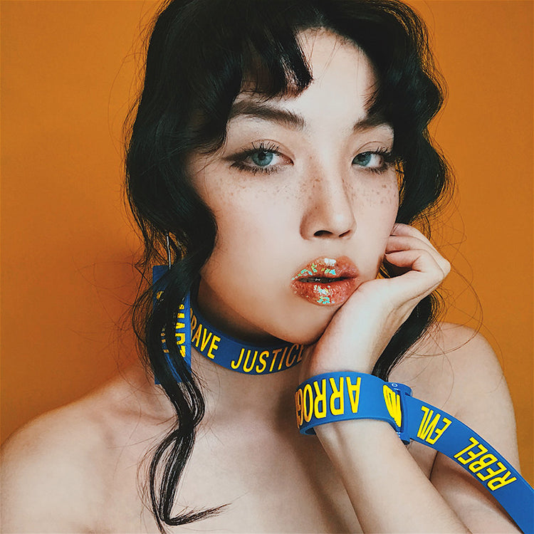 EOH-STUDIO BTBM blue BRAVE choker and blue EVIL strap styled at the wrist.