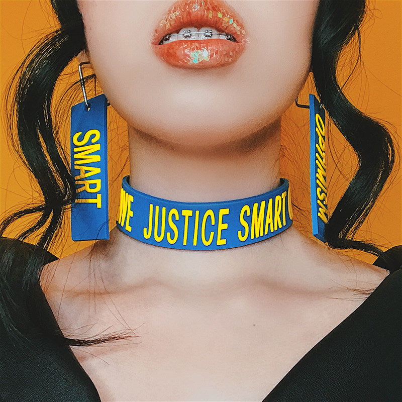 EOH-STUDIO BTBM blue SMART and OPTIMISM earrings worn with a matching blue choker; styling reference.