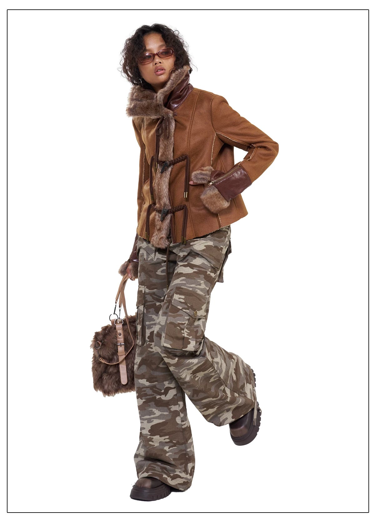 NEXT PASSPORT dark-brown rope-toggle shearling cropped jacket, white-background front pose holding bag strap