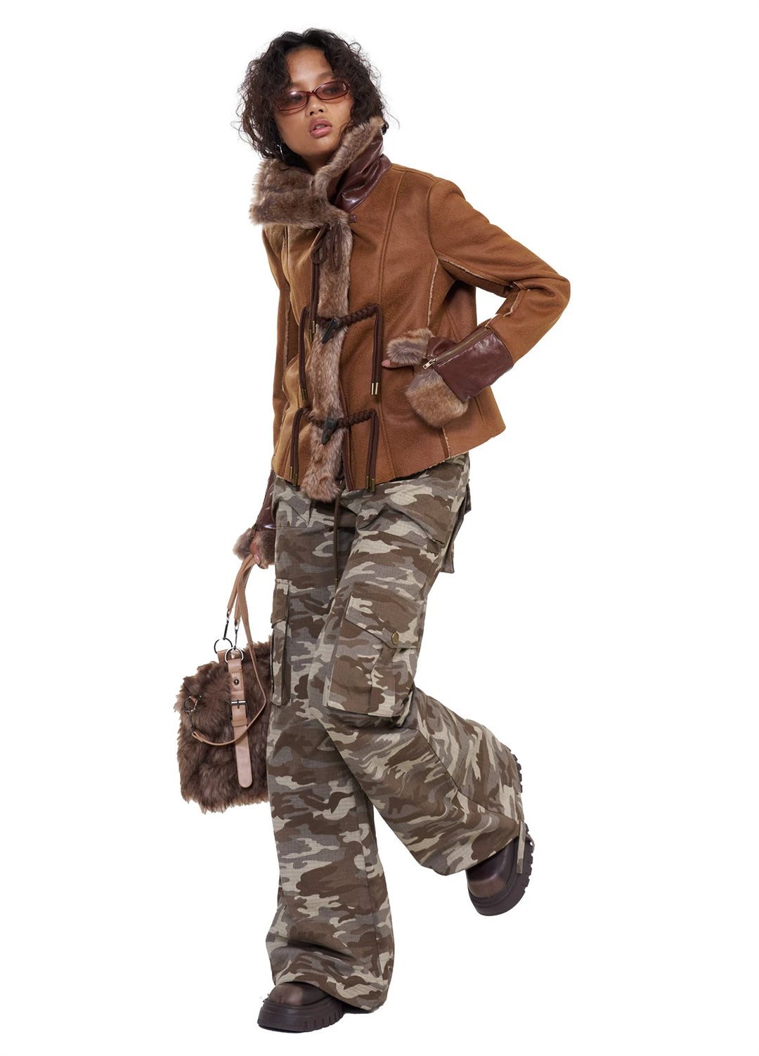 NEXT PASSPORT dark-brown rope-toggle shearling cropped jacket, white-background front pose holding bag strap