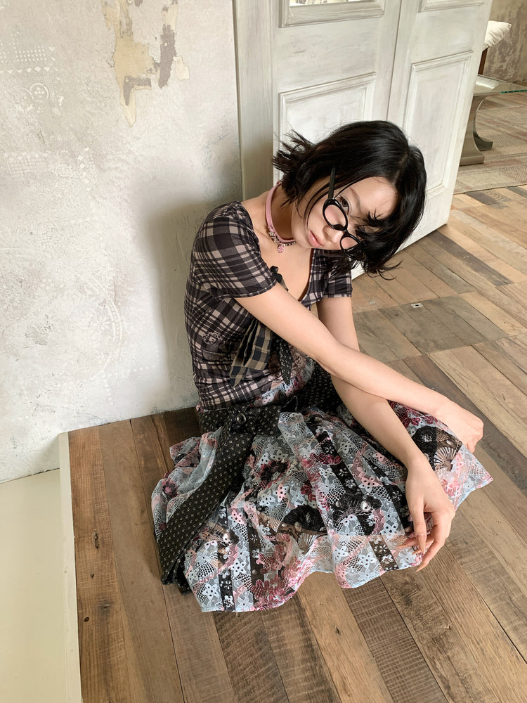 4RE1GN CROSS RIBBON jacquard lace layered skirt in multicolor — seated three-quarter modeled view