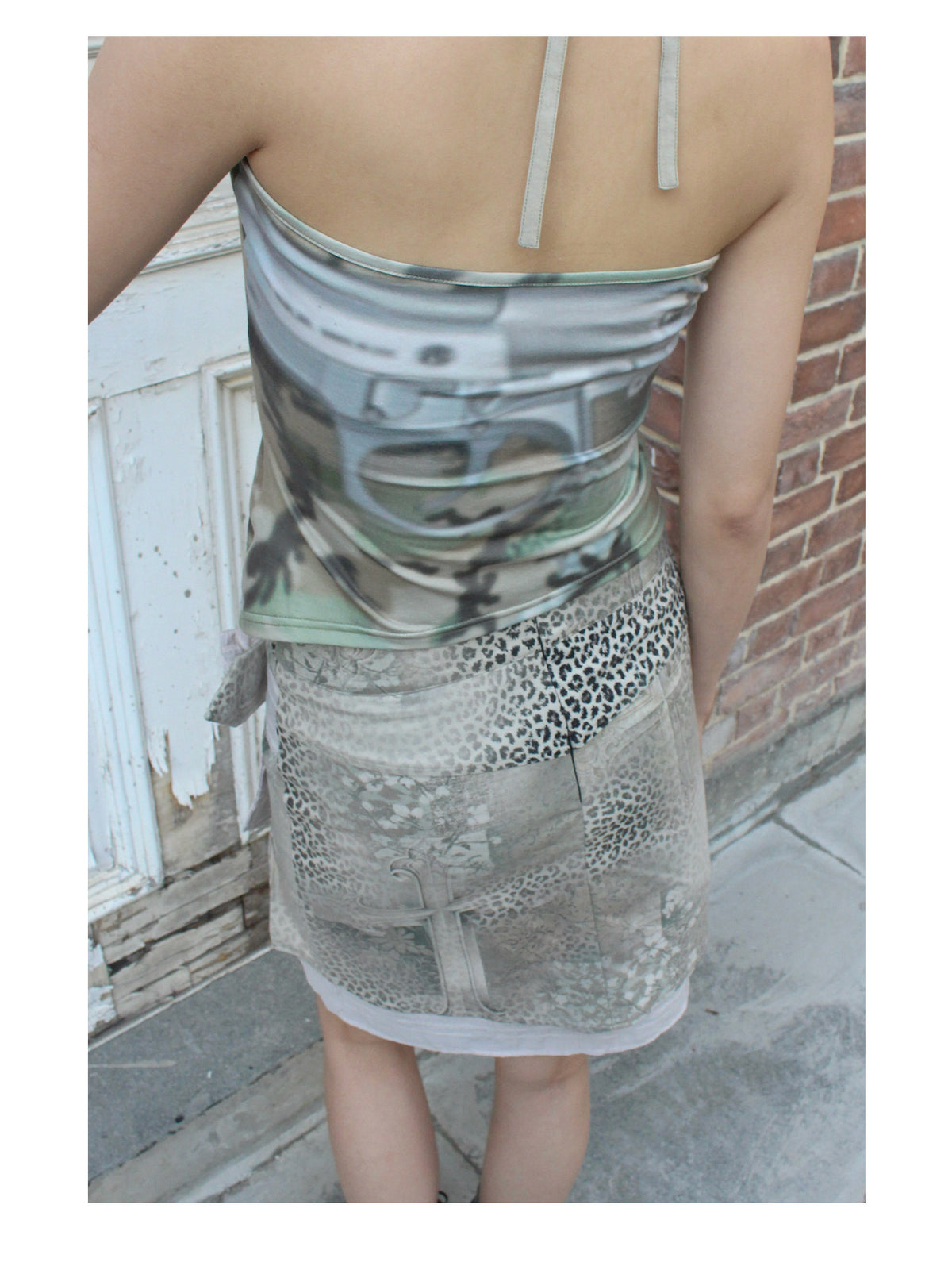 4RE1GN CROSS LEOPARD bow-detail layered skirt in beige multicolor — back modeled detail showing the cross and leopard print