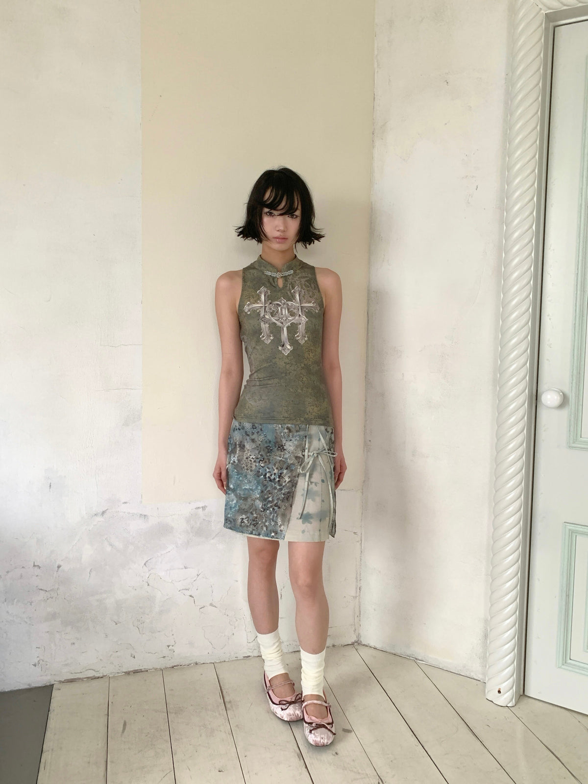 4RE1GN TRIPLE CROSS mandarin sleeveless top in olive green — full-length modeled view with the BLUE BLOOM layered skirt