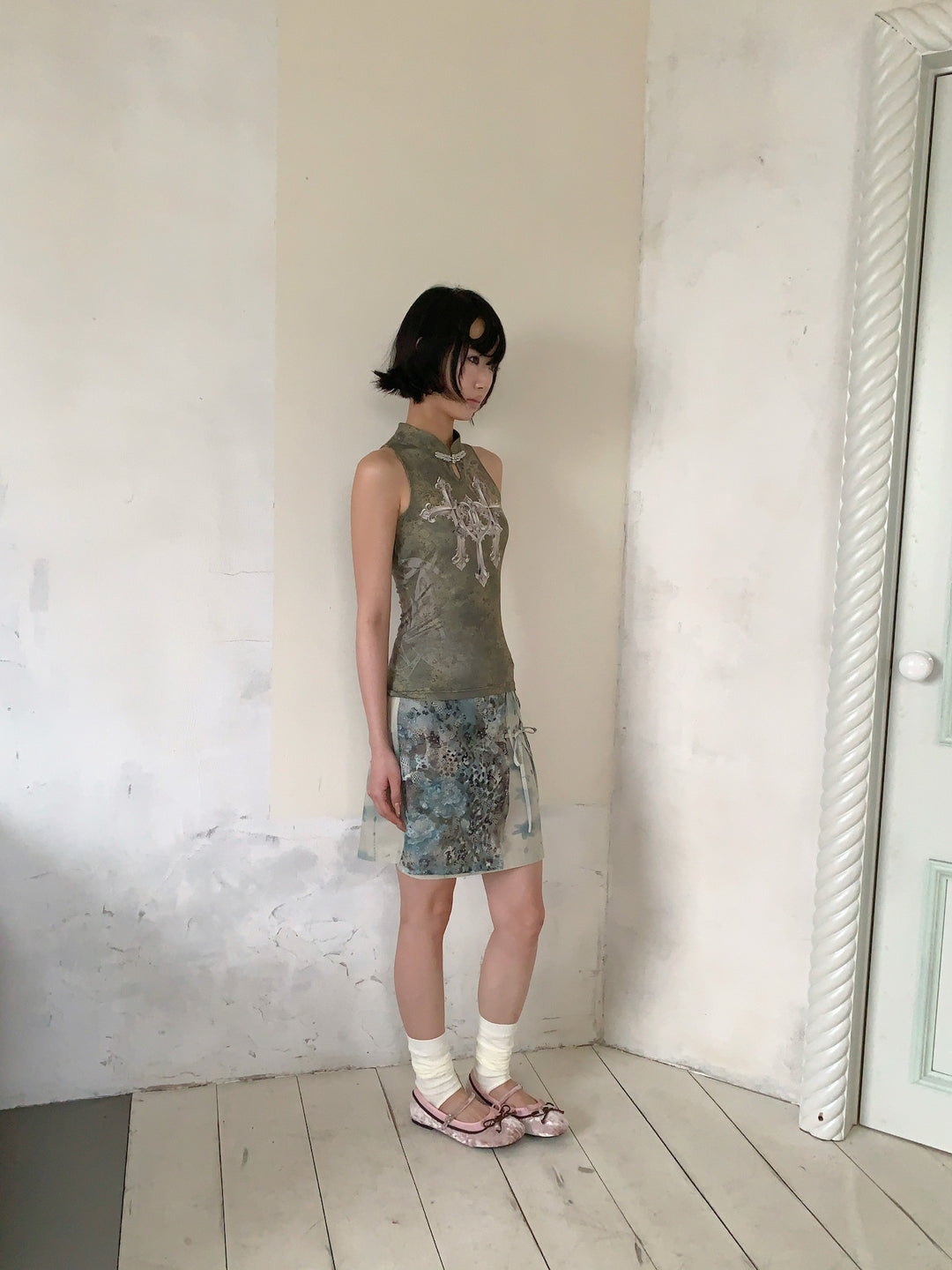 4RE1GN BLUE BLOOM tie-front layered skirt in blue multicolor — side modeled view styled with a sleeveless top
