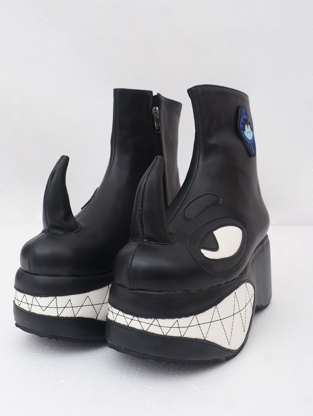 EMBRYO ANGRY horn-toe platform boots — front view