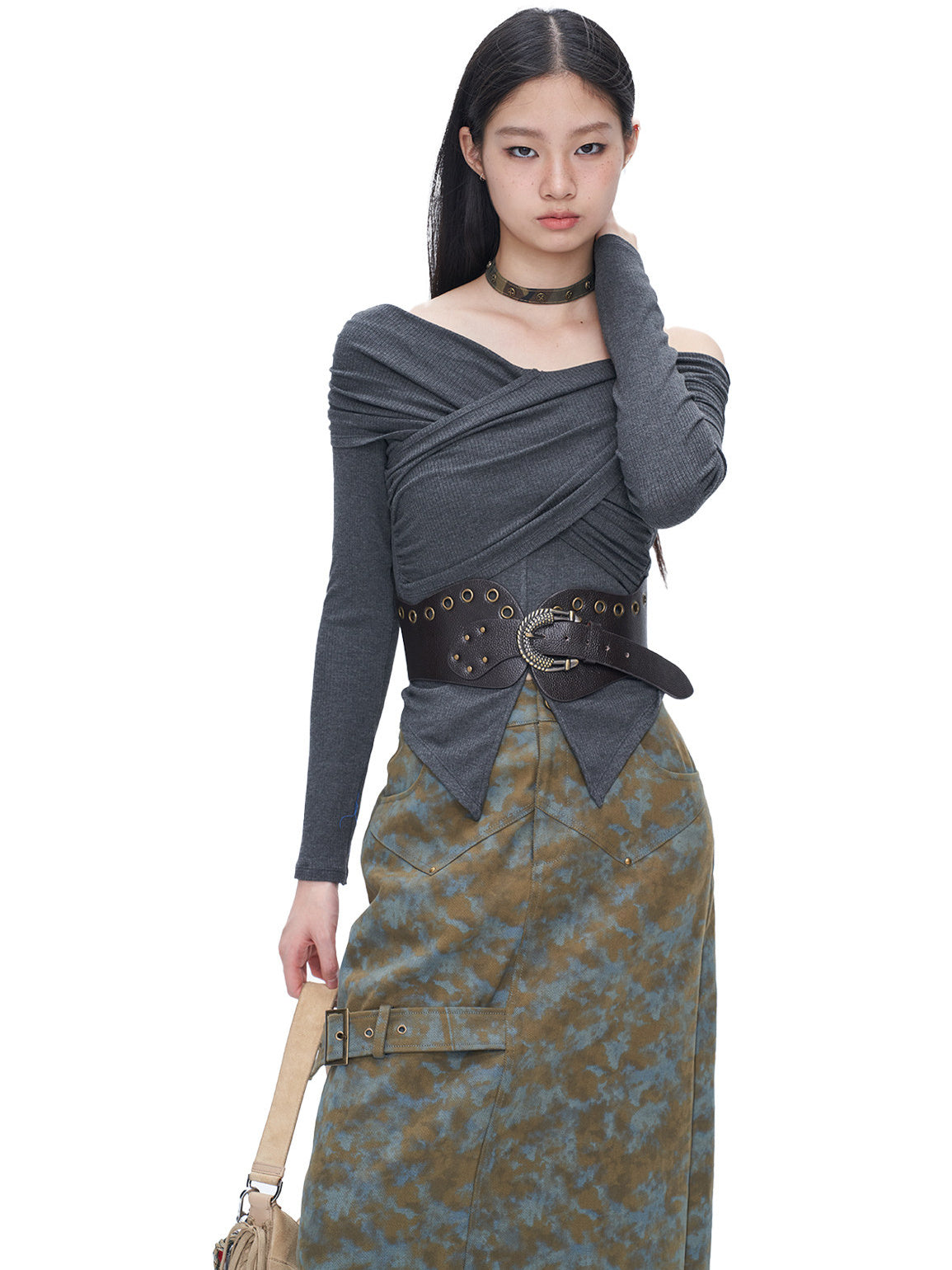 NEXT PASSPORT blue-brown tie-dye asymmetric denim midi skirt — three-quarter modeled view showing the front pockets and buckled strap.