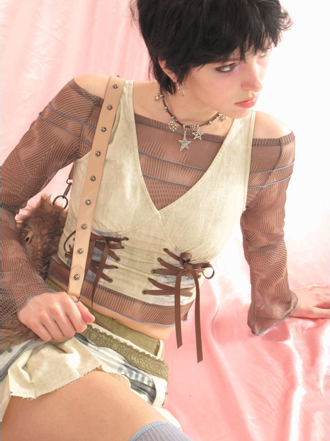 Close-up of the brown lace details and layered green skirt waistband