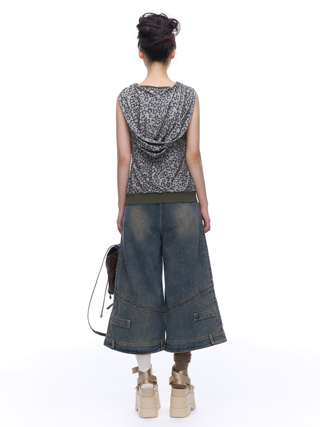 Back view of NEXT PASSPORT deconstructed wide-leg denim capri pants