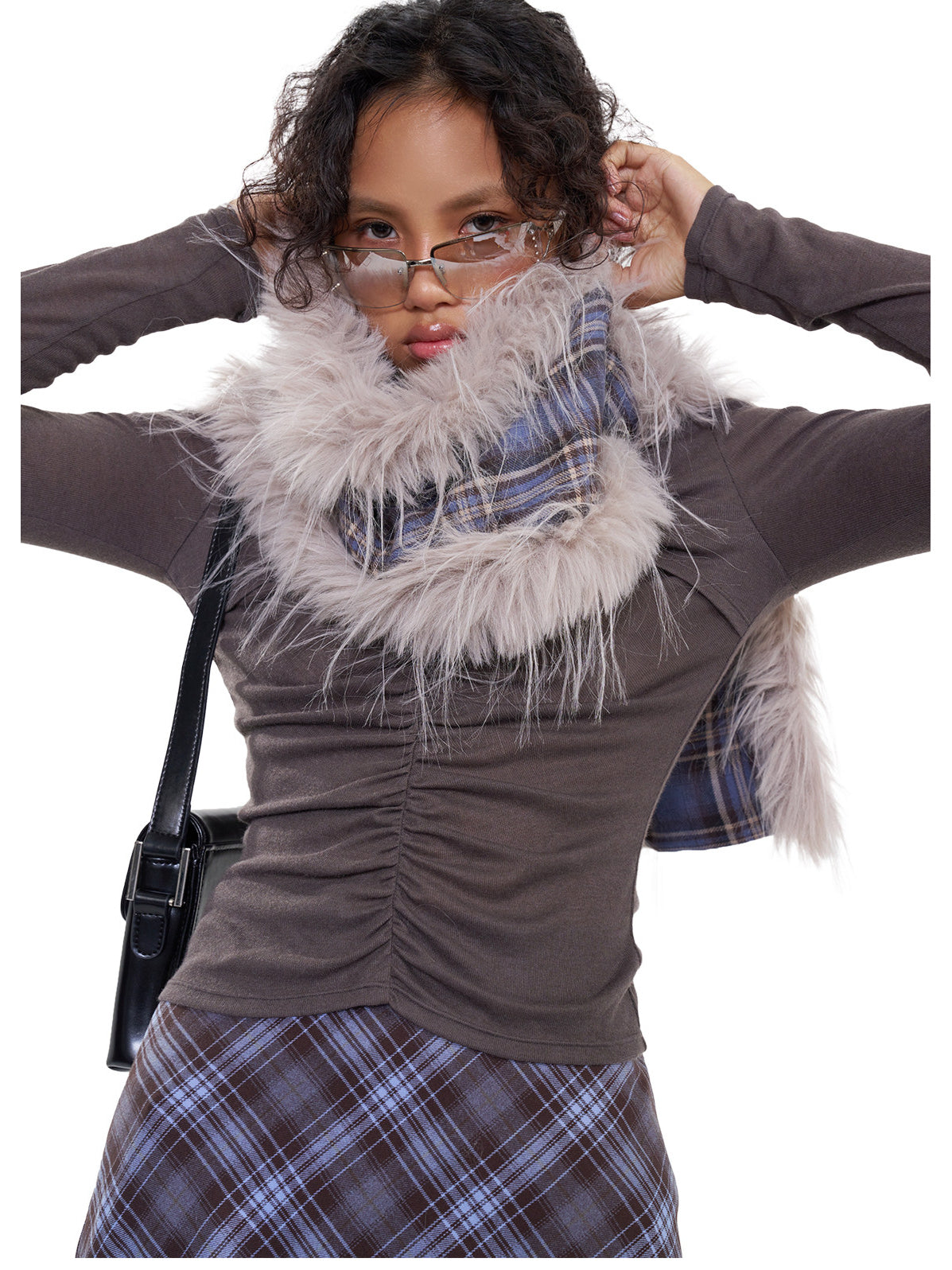 NEXT PASSPORT blue-purple plaid faux-fur scarf — straight-on modeled view wrapped high at the neck