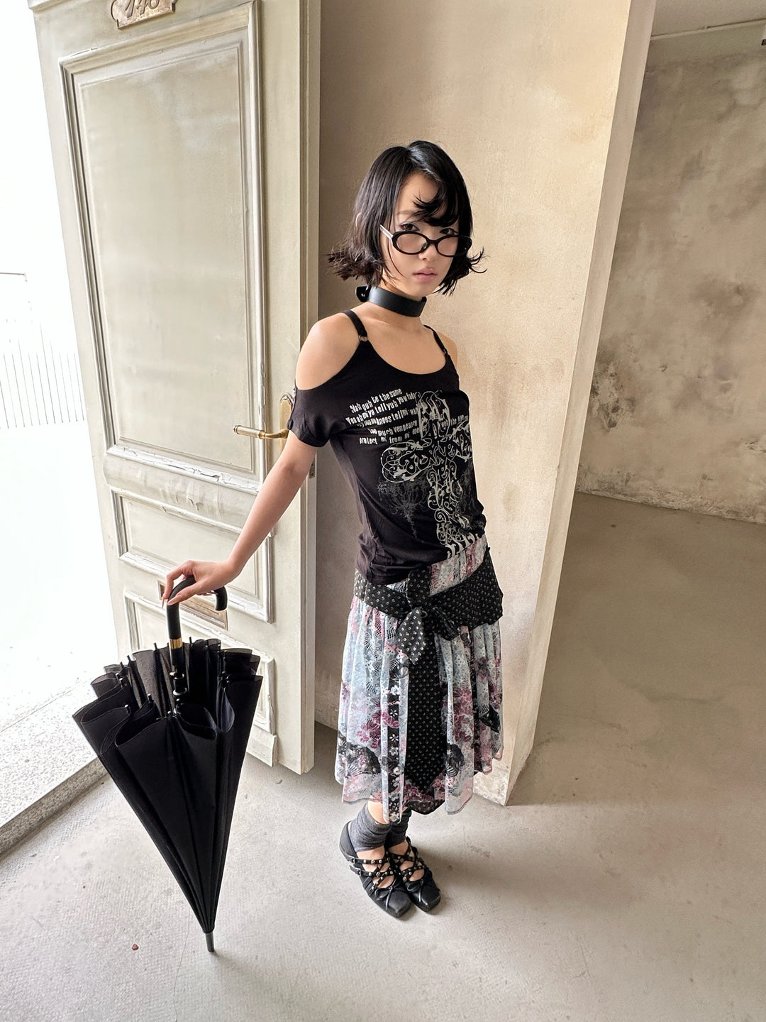 4RE1GN CROSS RIBBON jacquard lace layered skirt in multicolor — front modeled view holding a closed umbrella
