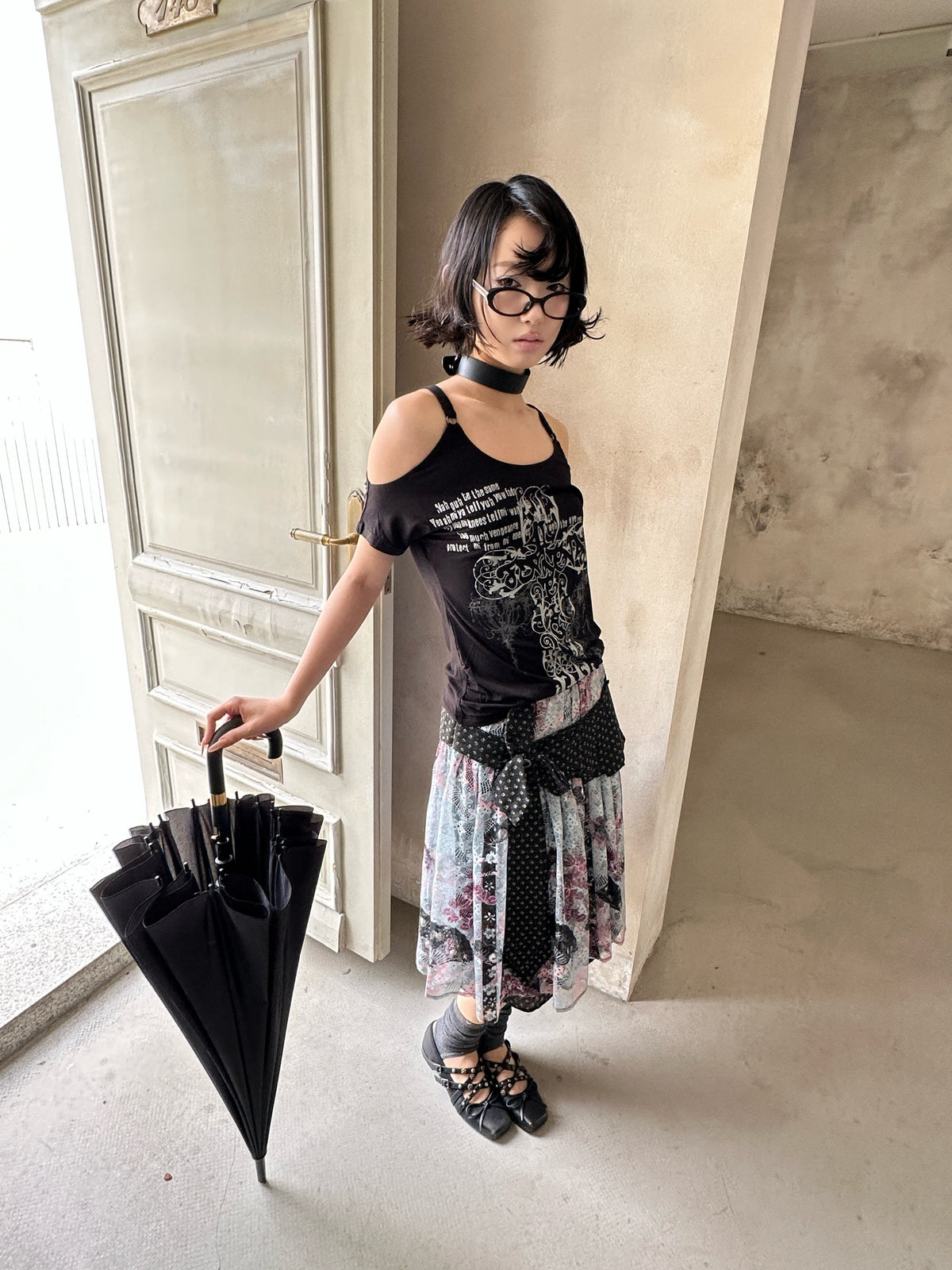 4RE1GN CROSS RIBBON jacquard lace layered skirt in multicolor — front modeled view holding a closed umbrella