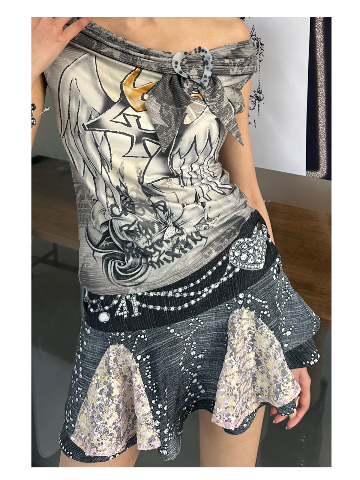 4RE1GN JEWEL denim-print lace mini skirt in black multicolor — close front view of the printed waistband and sequin panels