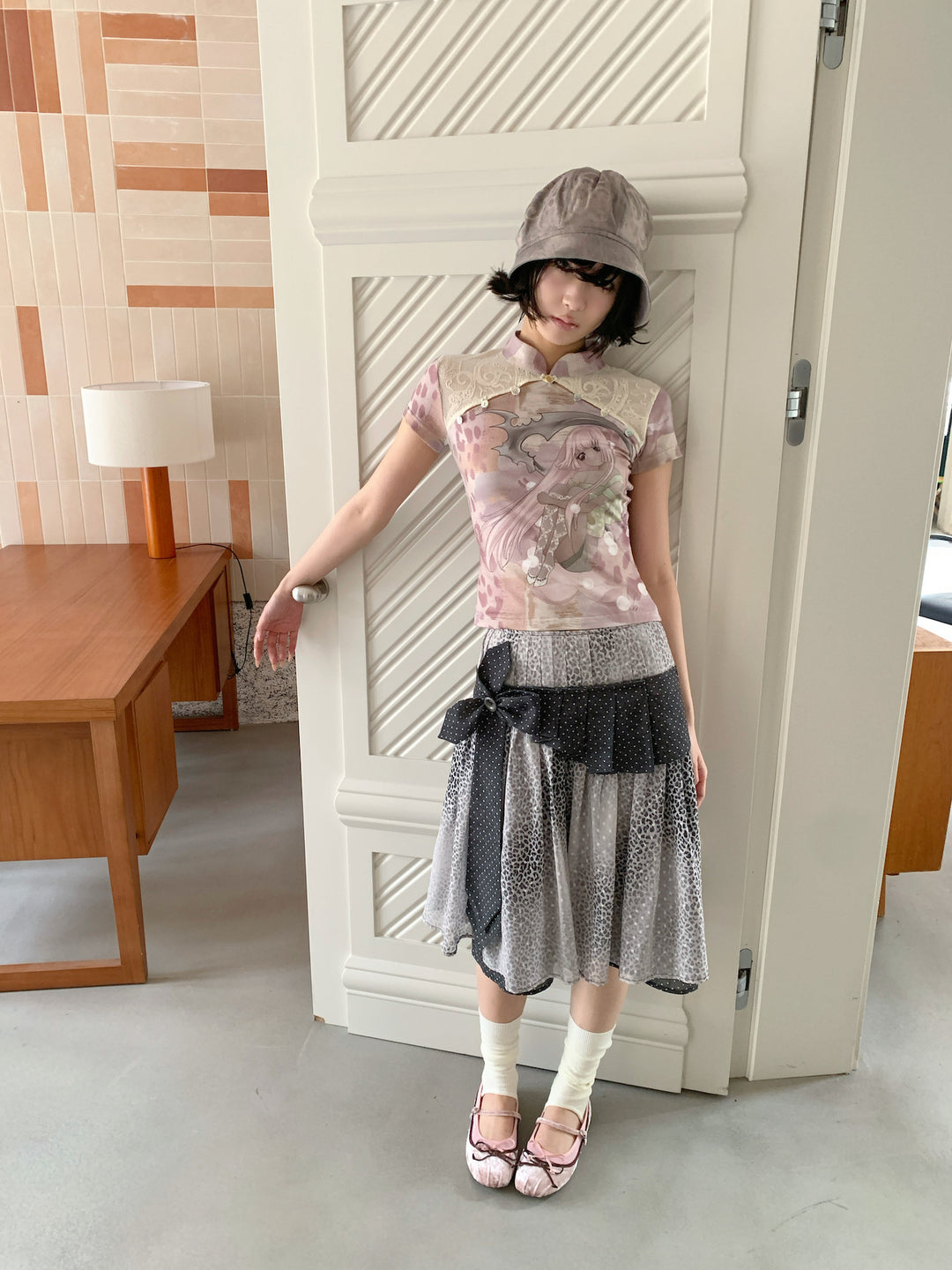 4RE1GN PINK REAPER lace-panel mandarin tee in pink multicolor — full-length modeled view beside a door