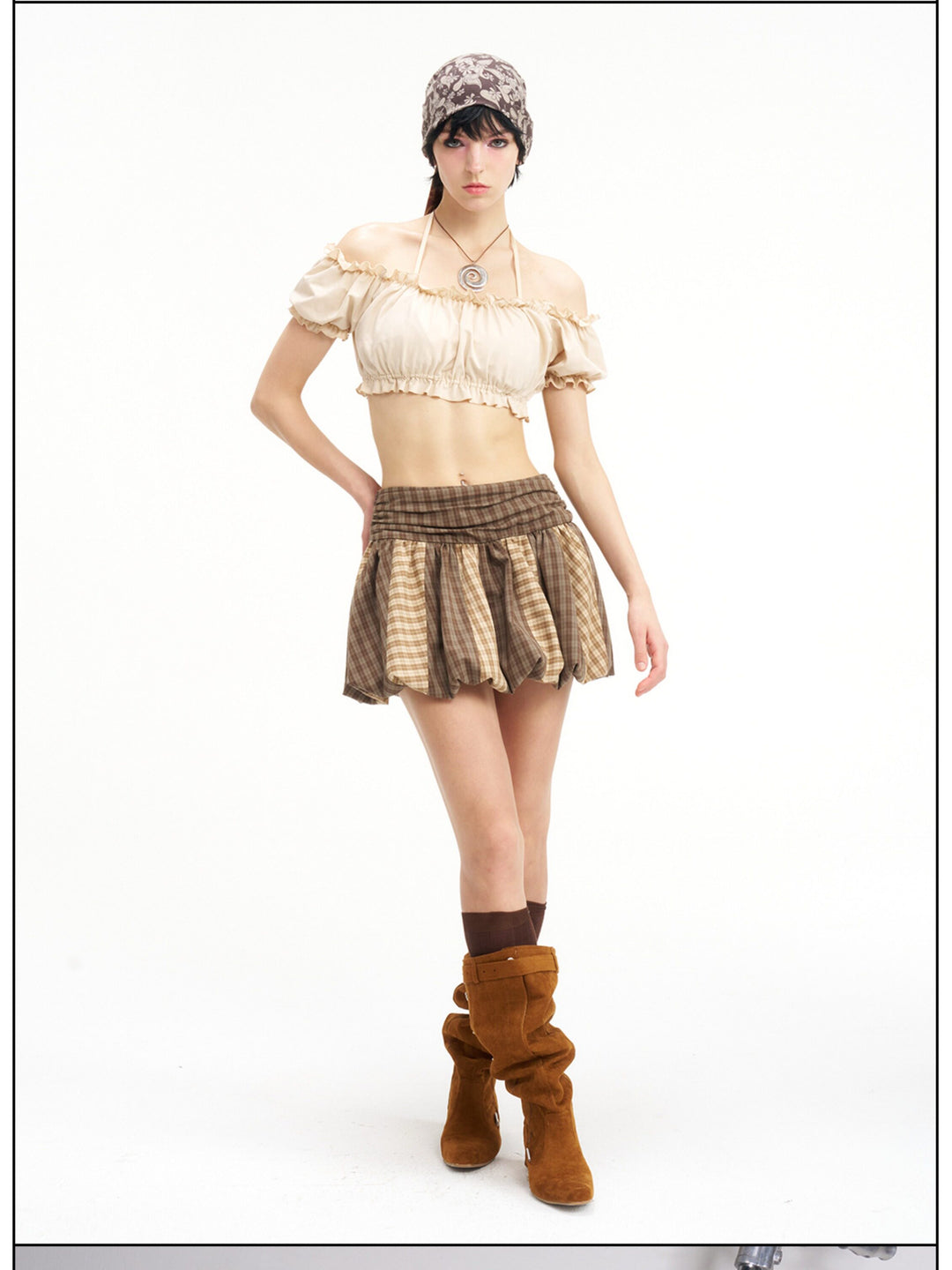Full-length studio view of the Next Passport brown plaid pumpkin skirt