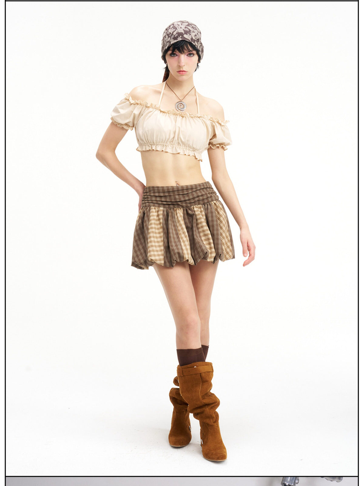 Full-length studio view of the Next Passport brown plaid pumpkin skirt