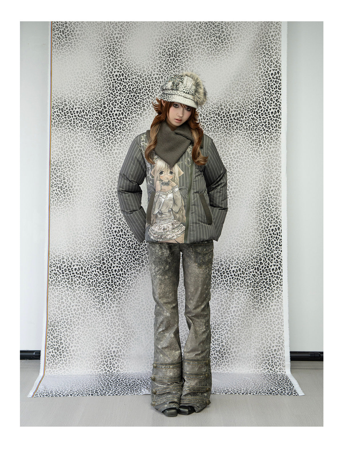 4RE1GN COMIC STRIPE asymmetric-collar down jacket in olive green — full-length modeled view beside a leopard-print backdrop