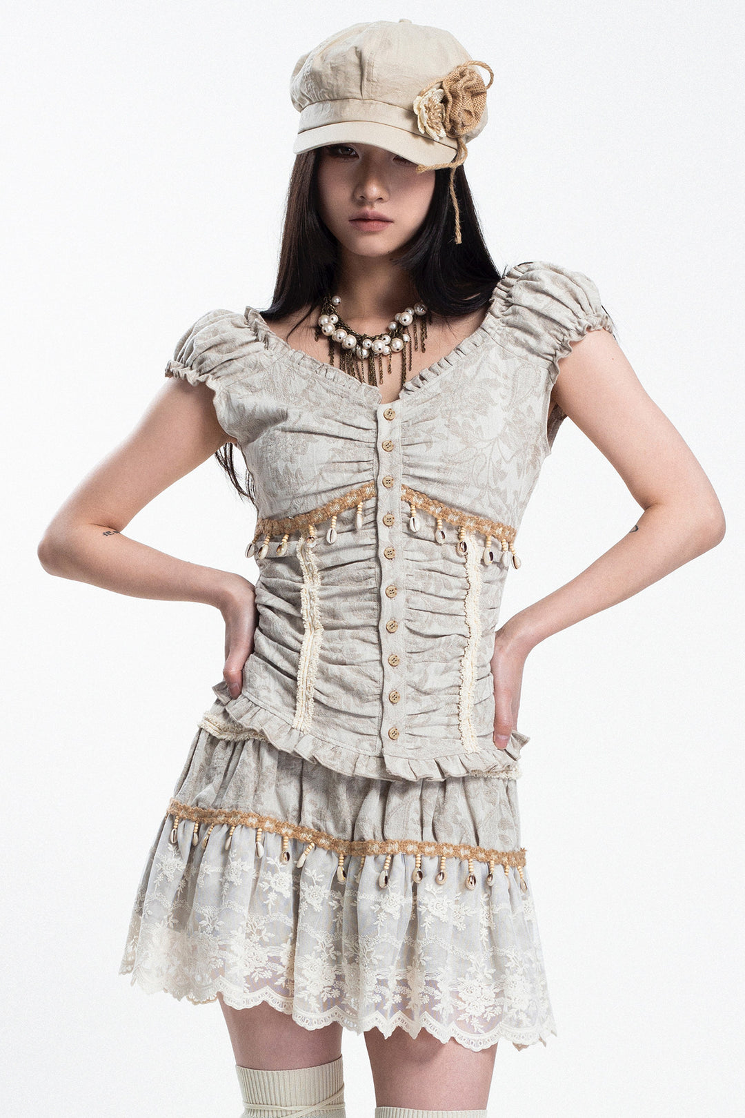 4RE1GN SHELL jacquard blouse and lace skirt separates in ivory — front studio modeled view with hands at the waist